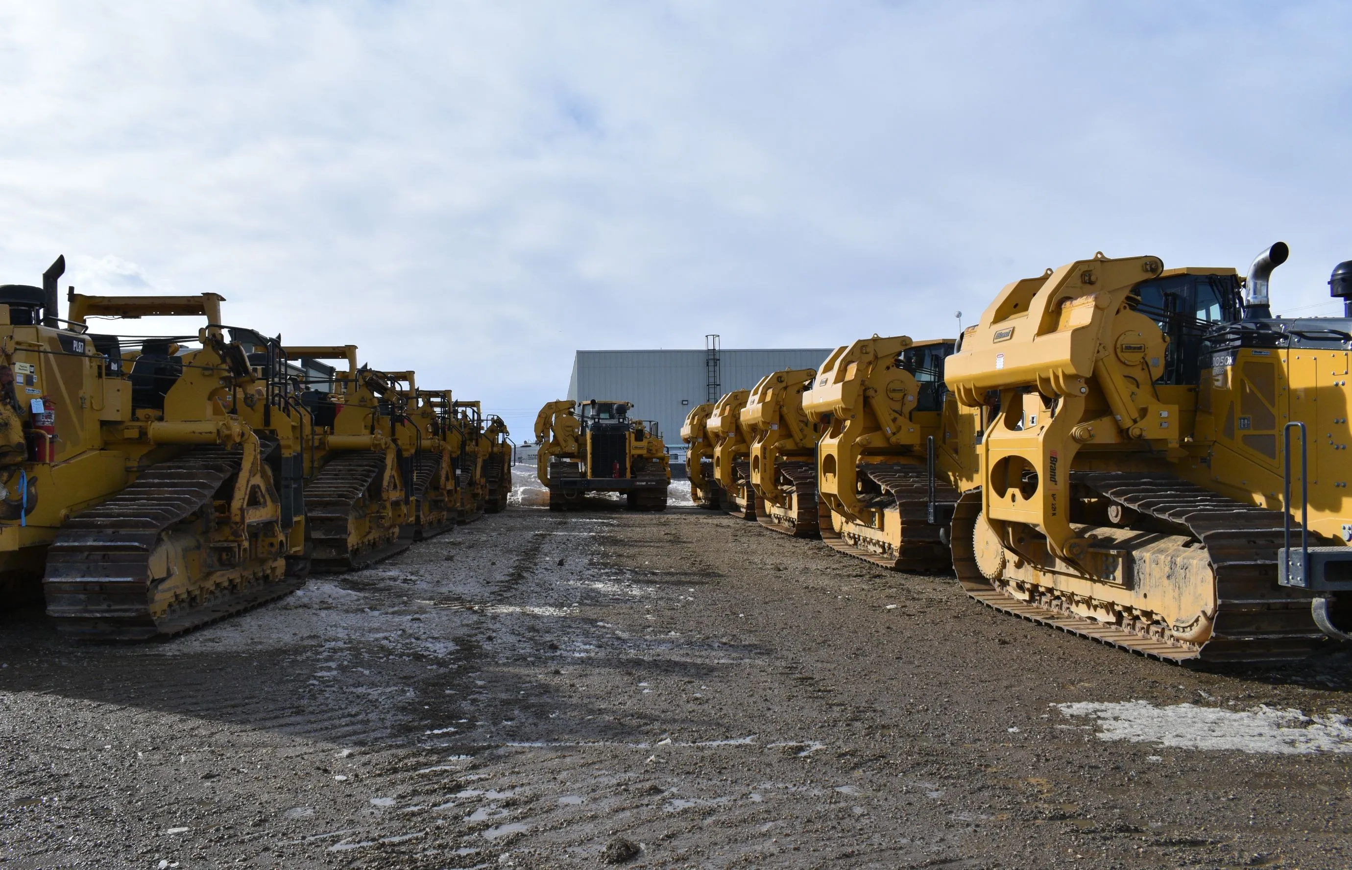 Several pipelayer machines lined up together